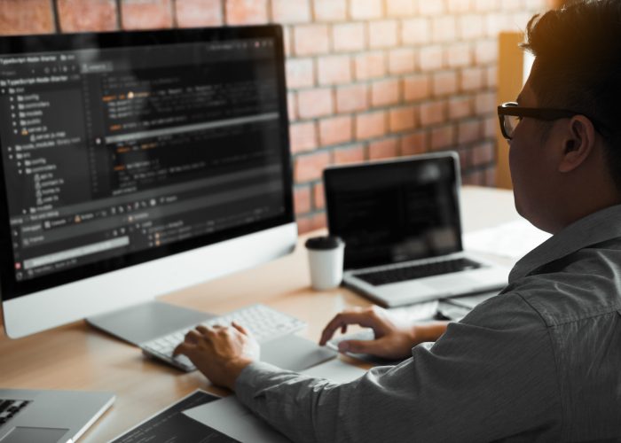 asian man working code program developer computer web developmen